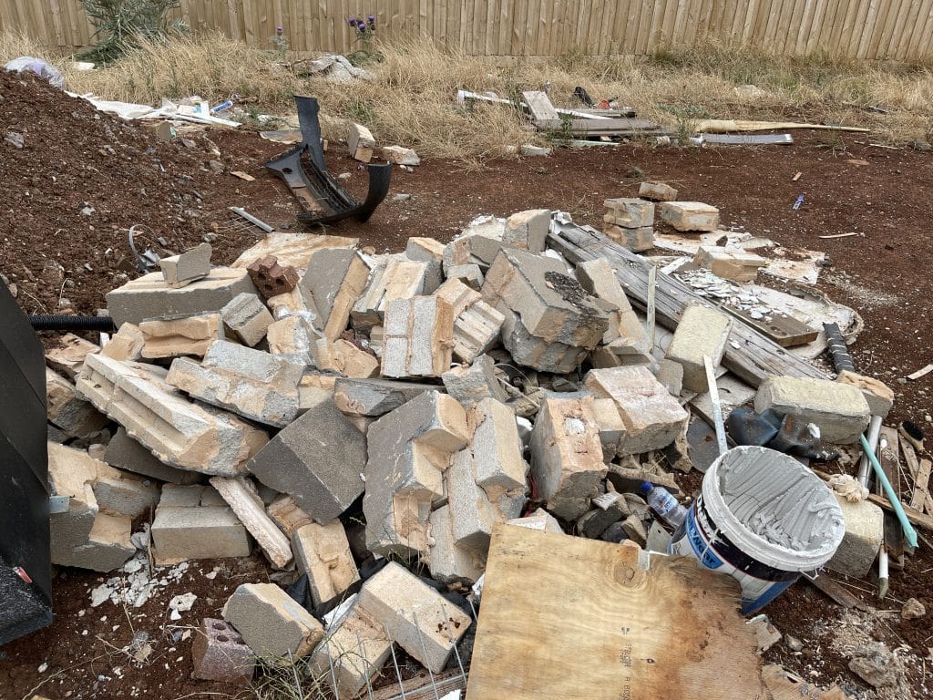 pile of bricks in builders waste pile