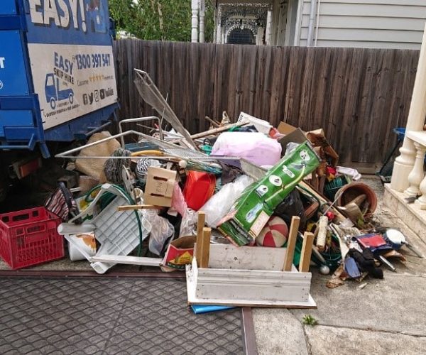 Rubbish on path being picked up by truck