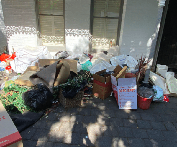 Rubbish on path outside buidling